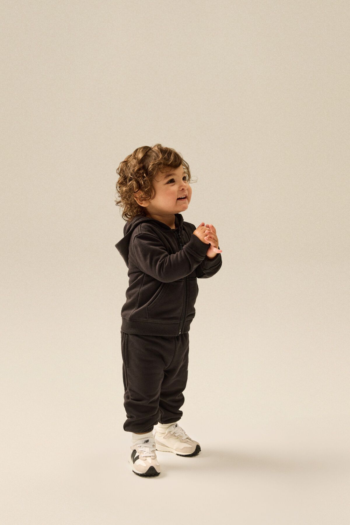 Small child standing in a matching clothing set